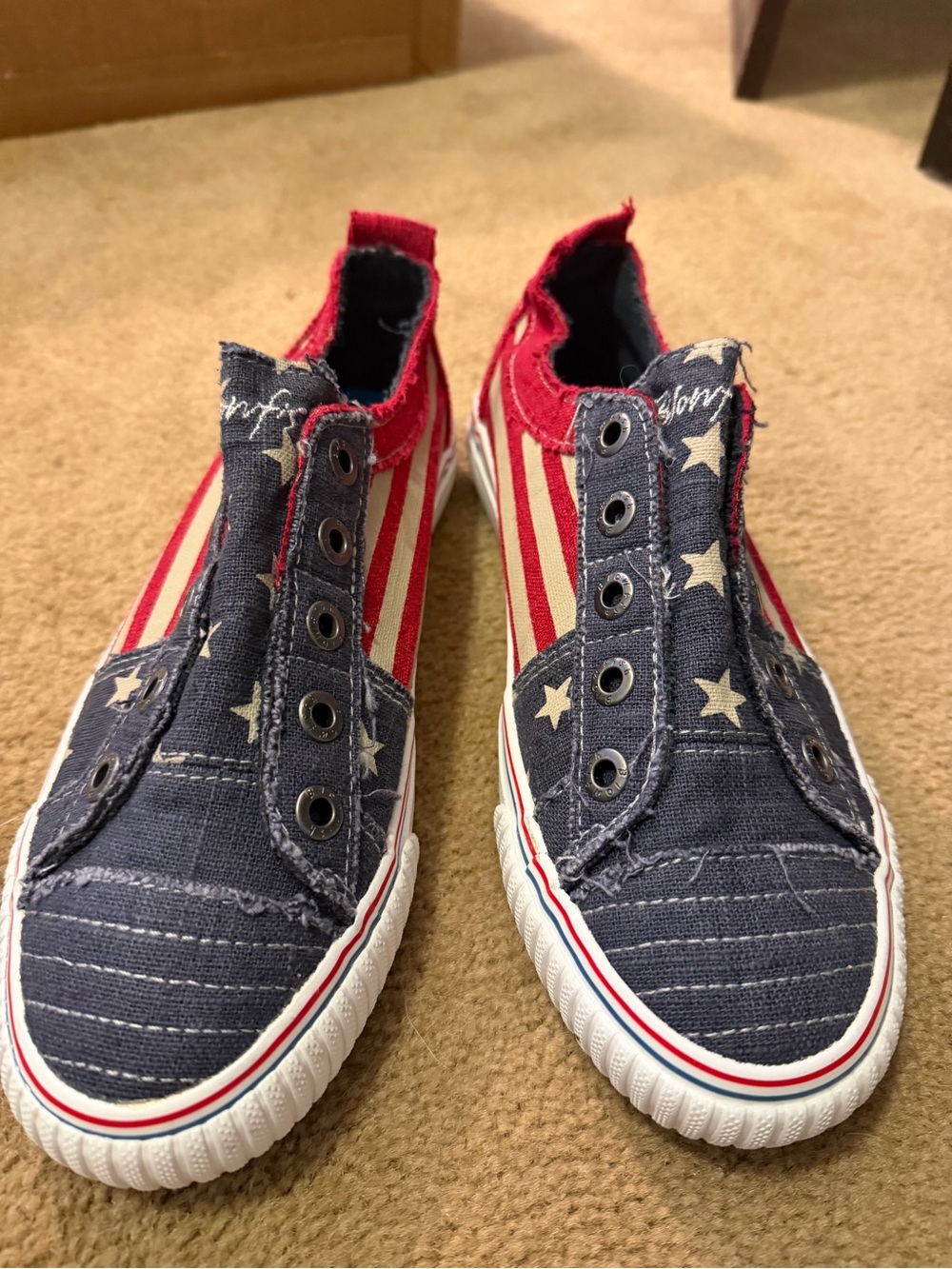 Women’s US8.5. American flag Blowfish slip on sneakers.